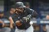 Miami Marlins' Ali Sanchez bunts into a fielder's choice off Tampa Bay Rays relief pitcher Edwin Uceta during the seventh inning of a baseball game Wednesday, July 31, 2024, in St. Petersburg, Fla. (AP Photo/Christopher O'Meara)