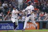 Houston Astros' Chas McCormick, left, and Jeremy Pena (3) celebrate the score by Pena on a wild pitch by the Pittsburgh Pirates during the second inning of a baseball game Wednesday, July 31, 2024, in Houston. (AP Photo/Michael Wyke)