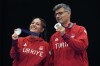 Turkey's Savval Ilayda Tarhan, left, and Yususf Dikec pose for a photograph after winning the silver medal in the 10m air pistol mixed team event at the 2024 Summer Olympics, Tuesday, July 30, 2024, in Chateauroux, France. (AP Photo/Manish Swarup)
