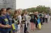 People attend a flash mob to highlight the plight of hundreds of Ukrainian athletes and coaches, both amateur and professional, who were killed as a result of Russia's war in Ukraine in Paris, France, Wednesday, July 31, 2024, during the 2024 Summer Olympics. (AP Photo/Hanna Arhirova)