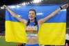 FILE - Yaroslava Mahuchikh, of Ukraine, smiles after winning the gold medal in the women's high jump final at the European Athletics Championships in Rome, June 9, 2024. (AP Photo/Andrew Medichini, File)
