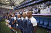 France's head coach Thierry Henry, right, sings the national anthem before the start of the men's Group A soccer match between New Zealand and France, at the Velodrome stadium, during the 2024 Summer Olympics, Tuesday, July 30, 2024, in Marseille, France. (AP Photo/Daniel Cole)