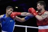 Canada's Wyatt Sanford, right, fights Uzbekistan's Ruslan Abdullaev in their men's 63.5kg quarterfinal boxing match at the 2024 Summer Olympics, Thursday, Aug. 1, 2024, in Paris, France. (AP Photo/John Locher)