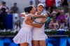 Mirra Andreeva and Diana Shnaider of Individual Neutral Athlete celebrate their victory over Cristina Bucsa and Sara Sorribes Tormo during women's doubles semifinals tennis match at the Roland Garros stadium, at the 2024 Summer Olympics, Friday, Aug. 2, 2024, in Paris, France. (AP Photo/Manu Fernandez)