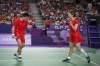 China's Zheng Si Wei, left, and Huang Ya Qiong celebrate a point as they play against South Korea's Kim Won-ho and Jeong Na-eun during their mixed doubles badminton final match at the 2024 Summer Olympics, Friday, Aug. 2, 2024, in Paris, France. (AP Photo/Dita Alangkara)