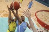Giannis Antetokounmpo, of Greece, shoots in front of Dante Exum, of Australia, in a men's basketball game at the 2024 Summer Olympics, Friday, Aug. 2, 2024, in Villeneuve-d'Ascq, France. (Gregory Shamus/Pool Photo via AP)
