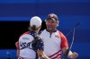 Brady Ellison, of the United States celebrates with Casey Kaufhold after winning the Archery mixed team bronze medal match against India's Ankita Bhakat and Dhiraj Bommadevara at the 2024 Summer Olympics, Friday, Aug. 2, 2024, in Paris, France. (AP Photo/Brynn Anderson)
