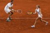 Mirra Andreeva and Daniil Medvedev of Russia compete against Sara Errani and Andrea Vavassori of Italy during the mix doubles tennis competition at the Roland Garros stadium, at the 2024 Summer Olympics, Monday, July 29, 2024, in Paris, France. (AP Photo/Manu Fernandez)