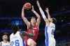 Franz Wagner, of Germany, shoots over Isaia Cordinier, of France, in a men's basketball game at the 2024 Summer Olympics, Friday, Aug. 2, 2024, in Villeneuve-d'Ascq, France. (AP Photo/Mark J. Terrill)