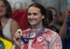 Kylie Masse, of LaSalle, Ont., displays her bronze medal after the women's 200-metre backstroke final at the 2024 Summer Olympics in Nanterre, France, Friday, Aug. 2, 2024. THE CANADIAN PRESS/Christinne Muschi