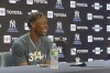 New York Yankees' Jazz Chisholm Jr. wears a T-shirt referring to Yankee Stadium's right-field wall that sits a mere 314 feet from home plate, before his home debut for the Yankees in a baseball game against the Toronto Blue Jays, Friday, Aug. 2, 2024. (AP Photo/Ron Blum)