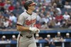 Baltimore Orioles' Coby Mayo heads to first base with a walk by Cleveland Guardians starting pitcher Carlos Carrasco during the second inning of a baseball game in Cleveland, Friday, Aug. 2, 2024. It was Mayo's first major league at-bat. (AP Photo/Phil Long)