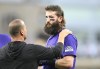 An unidentified trainer, left, looks at Colorado Rockies' Charlie Blackmon, right, after Blackmon was hit with a throw during the third inning of a baseball game against the San Diego Padres, Friday, Aug. 2, 2024, in San Diego. (AP Photo/Denis Poroy)