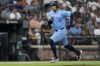 Toronto Blue Jays' George Springer advances toward home base to score on a sacrifice fly hit by Davis Schneider during the fourth inning in the second baseball game of a doubleheader against the Baltimore Orioles, Monday, July 29, 2024, in Baltimore. (AP Photo/Stephanie Scarbrough)