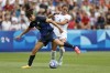 Japan's Saki Kumagai holds off Trinity Rodman of the United States during the quarterfinal women's soccer match between the United States and the Japan at the Parc des Princes at the 2024 Summer Olympics, Saturday, Aug. 3, 2024, in Paris, France. (AP Photo/Aurelien Morissard)