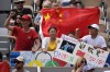 Supporters of China's Zheng Qinwen display a Chinese flag as she plays Croatia's Donna Vekic during the Women's Singles tennis final at the Roland Garros stadium at the 2024 Summer Olympics, Saturday, Aug. 3, 2024, in Paris, France. (AP Photo/Manu Fernandez)