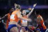 Femke Bol, of the Netherlands, celebrates after anchoring her team to victory in the 4x400-meter relay mixed final at the 2024 Summer Olympics, Saturday, Aug. 3, 2024, in Saint-Denis, France. (AP Photo/Petr David Josek)