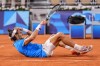 Lorenzo Musetti of Italy reacts after defeating Felix Auger-Aliassime of Canada during men's singles bronze medal tennis match at the Roland Garros stadium, at the 2024 Summer Olympics, Saturday, Aug. 3, 2024, in Paris, France. (AP Photo/Manu Fernandez)