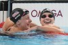 United States' Katie Ledecky celebrates with teammate Paige Madden after winning the gold medal in the women's 800-meter freestyle final at the Summer Olympics in Nanterre, France, Saturday, Aug. 3, 2024. (AP Photo/Brynn Anderson)
