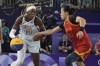 China's Wang Lili (23) defends Rhyne Howard (10), of the United States, in a women's 3x3 basketball play-in game during the 2024 Summer Olympics, Saturday, Aug. 3, 2024, in Paris, France. The United States won 21-13. (AP Photo/Frank Franklin II)