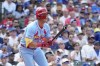 St. Louis Cardinals' Lars Nootbaar watches his RBI sacrifice fly during the ninth inning of a baseball game against the Chicago Cubs on Saturday, Aug. 3, 2024, in Chicago. (AP Photo/Charles Rex Arbogast)