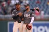 Washington Nationals' Trey Lipscomb, left, and Luis Garcia Jr., right, celebrate after a baseball game against the Milwaukee Brewers, Saturday, Aug. 3, 2024, in Washington. (AP Photo/Nick Wass)