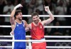 Canada's Wyatt Sanford, right, and Sofiane Oumiha of France react after the men's 63.5 kg semifinal boxing match at the 2024 Summer Olympics, Sunday, August 4, 2024 in Paris, France. THE CANADIAN PRESS/Christinne Muschi