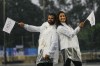 Judo competitors Mohammad Rashnonezhad, left, and Nigara Shaheen, both of the Olympic refugee team, pose for a photograph in Paris, France, during the opening ceremony of the 2024 Summer Olympics, Friday, July 26, 2024. THE CANADIAN PRESS/AP-Andy Wong