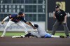 Houston Astros shortstop Jeremy Peña, left, catches Tampa Bay Rays' Taylor Walls, center, who was trying to steal second base as umpire Doug Eddings, right, makes the call during the fourth inning of a baseball game Sunday, Aug. 4, 2024, in Houston. (AP Photo/Kevin M. Cox)