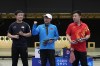 China's Li Yuehong, center, South Korea's Cho Yeong-jae, left, and China's Wang Xinjie pose for a photograph after finishing first, second and third respectively in the 25m rapid fire pistol men's final at the 2024 Summer Olympics, Monday, Aug. 5, 2024, in Chateauroux, France. (AP Photo/Manish Swarup)