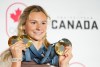 Canada's Summer McIntosh of Toronto poses with her four medals won in the pool at the 2024 Summer Olympics, Monday, Aug. 5, 2024 in Paris, France. The three gold medals were for the 200m Butterfly, the 200m Individual Medley and the 400m Individual Medley and the one silver was for the 400m Freestyle. THE CANADIAN PRESS/Christinne Muschi