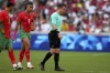 Referee Ilgiz Tantashev, of Uzbekistan, leaves the field after being injured during a men's semifinal soccer match between Morocco and Spain at the 2024 Summer Olympics, Monday, Aug. 5, 2024, at Marseille Stadium in Marseille, France. (AP Photo/Daniel Cole)