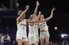 From left; Germany's Marie Reichert, Svenja Brunckhorst, Sonja Greinacher and Elisa Mevius celebrate after a women's 3x3 basketball gold medal game against Spain at the 2024 Summer Olympics, Monday, Aug. 5, 2024, in Paris, France. (AP Photo/Frank Franklin II)