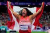 Canada's Camryn Rogers celebrates her gold medal won in the women's hammer throw event at the Summer Olympics in Paris, Tuesday, Aug. 6, 2024. THE CANADIAN PRESS/Adrian Wyld