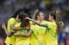 Brazilian players celebrate their side's 2nd goal scored by teammate Gabi Portilho during a women's semifinal soccer match between Brazil and Spain at the 2024 Summer Olympics, Tuesday, Aug. 6, 2024, at Marseille Stadium in Marseille, France. (AP Photo/Julio Cortez)