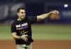 FILE - Bill Bean, MLB's vice president of Social Responsibility and Inclusion, throws out the ceremonial first pitch before a baseball game between the Tampa Bay Rays and the San Francisco Giants, June 17, 2016, in St. Petersburg, Fla. (AP Photo/Chris O'Meara, File)
