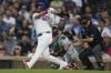 Chicago Cubs' Isaac Paredes hits a three-run home run during the first inning of a baseball game against the Minnesota Twins Tuesday, Aug. 6, 2024, in Chicago. (AP Photo/Melissa Tamez)