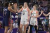 United States' Cierra Burdick (7) high fives Canada's Katherine Plouffe (2) after the USA's win over Canada in the women's 3x3 basketball bronze medal game at the 2024 Summer Olympics, Monday, Aug. 5, 2024, in Paris, France. THE CANADIAN PRESS/AP/Frank Franklin II