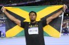 Roje Stona, of Jamaica, celebrates after winning the men's discus throw final at the 2024 Summer Olympics, Wednesday, Aug. 7, 2024, in Saint-Denis, France. (AP Photo/Matthias Schrader)
