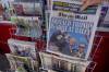 KIRSTY WIGGLESWORTH / THE ASSOCIATED PRESS
                                A woman buys a copy of the Mail on Sunday newspaper at a newsagents in London, Sunday, July 14, 2024, showing the reaction to events at former U.S. president Donald Trump&rsquo;s campaign rally in Butler, Pennsylvania. (AP Photo/Kirsty Wigglesworth)
