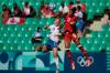 Silvia Izquierdo / The Associated Press
                                Canada&rsquo;s Jade Rose (right) and New Zealand&rsquo;s Katie Kitching vie for the ball Thursday in Olympic action.