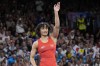 India's Vinesh Vinesh celebrates after defeating Cuba's Yusneylys Guzman during their women's freestyle 50kg wrestling semifinal match, at Champ-de-Mars Arena, during the 2024 Summer Olympics, Tuesday, Aug. 6, 2024, in Paris, France. (AP Photo/Eugene Hoshiko)