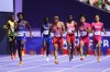 Andre De Grasse of Canada (centre) runs the final leg of the men's 4x100-meter relay heat at the 2024 Summer Olympics, Thursday, Aug. 8, 2024, in Saint-Denis, France. THE CANADIAN PRESS/AP/Petr David Josek