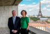 Second gentleman Doug Emhoff left, and UNESCO Director-General Audrey Azoulay pose for a photo on the balcony of the UNESCO headquarters after a meeting in Paris, Thursday, Aug. 8, 2024. (AP Photo/Michel Euler)