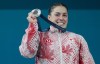 Canada's Maude Charron poses with her silver medal in the women's 59kg Weightlifting at the 2024 Summer Olympics, Thursday, August 8, 2024 in Paris, France.THE CANADIAN PRESS/Christinne Muschi