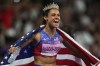 Women's 200-meter gold medalist Sydney McLaughlin-Levrone, of the United States, celebrates at the 2024 Summer Olympics, Thursday, Aug. 8, 2024, in Saint-Denis, France. (AP Photo/Petr David Josek)
