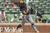 Milwaukee Brewers' William Contreras (24) hits a double during the fifth inning of a baseball game against the Atlanta Braves, Thursday, Aug. 8, 2024, in Atlanta. (AP Photo/Jason Allen)