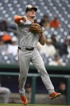 San Francisco Giants third baseman Matt Chapman throws to first to put out Washington Nationals' Jacob Young during the fifth inning of a baseball game, Thursday, Aug. 8, 2024, in Washington. (AP Photo/Nick Wass)