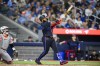 Toronto Blue Jays' Vladimir Guerrero Jr. (27) hits a two-run home run during the fifth inning of MLB baseball action against the Baltimore Orioles, in Toronto, on Thursday, August 8, 2024. THE CANADIAN PRESS/Christopher Katsarov