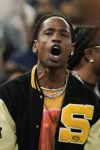Travis Scott watches the Serbia vs' United States game during a men's semifinals basketball game at Bercy Arena at the 2024 Summer Olympics, Thursday, Aug. 8, 2024, in Paris, France. (AP Photo/Mark J. Terrill)